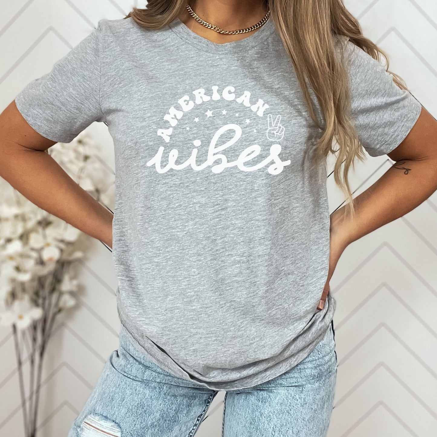 Casual and cute athletic grey "American Vibes" T-shirt for women with bold white retro font and patriotic design.