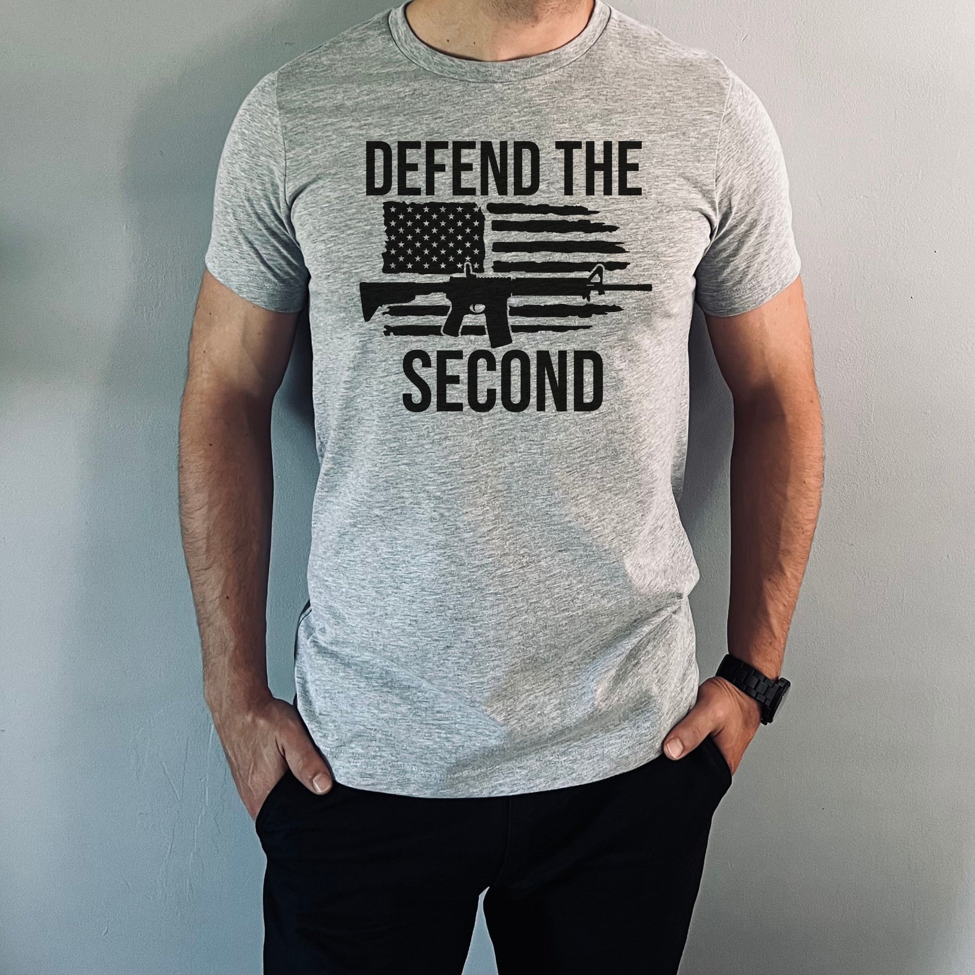 Men's athletic gray "Defend the Second" tee featuring bold rifle and distressed flag design, perfect for gun rights supporters.