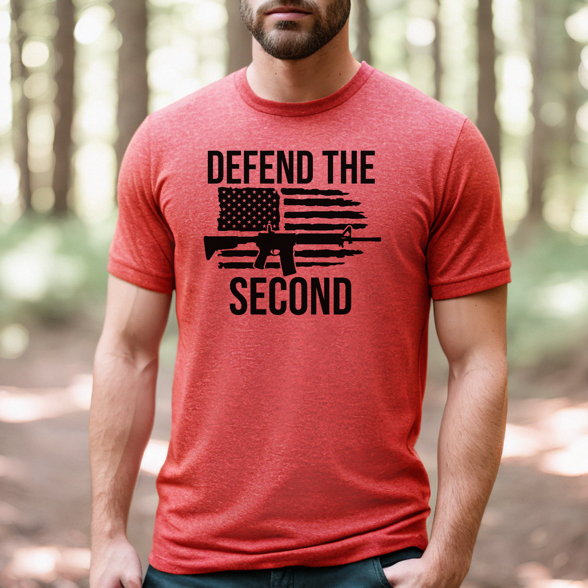 Heather red "Defend the Second" shirt modeled by a man standing in the woods, pro-Second Amendment message across chest.