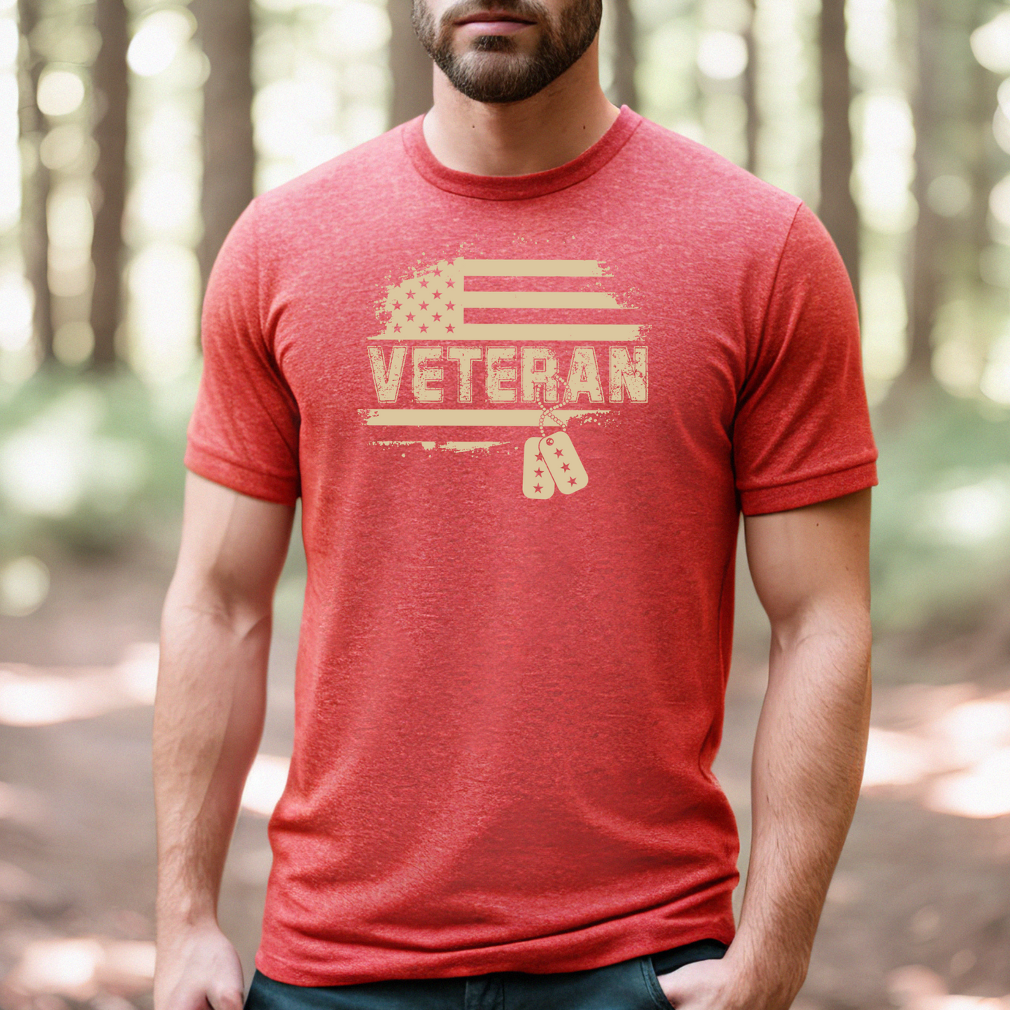 Vintage beige Veteran text and flag design on heather red t-shirt, modeled in wooded path.