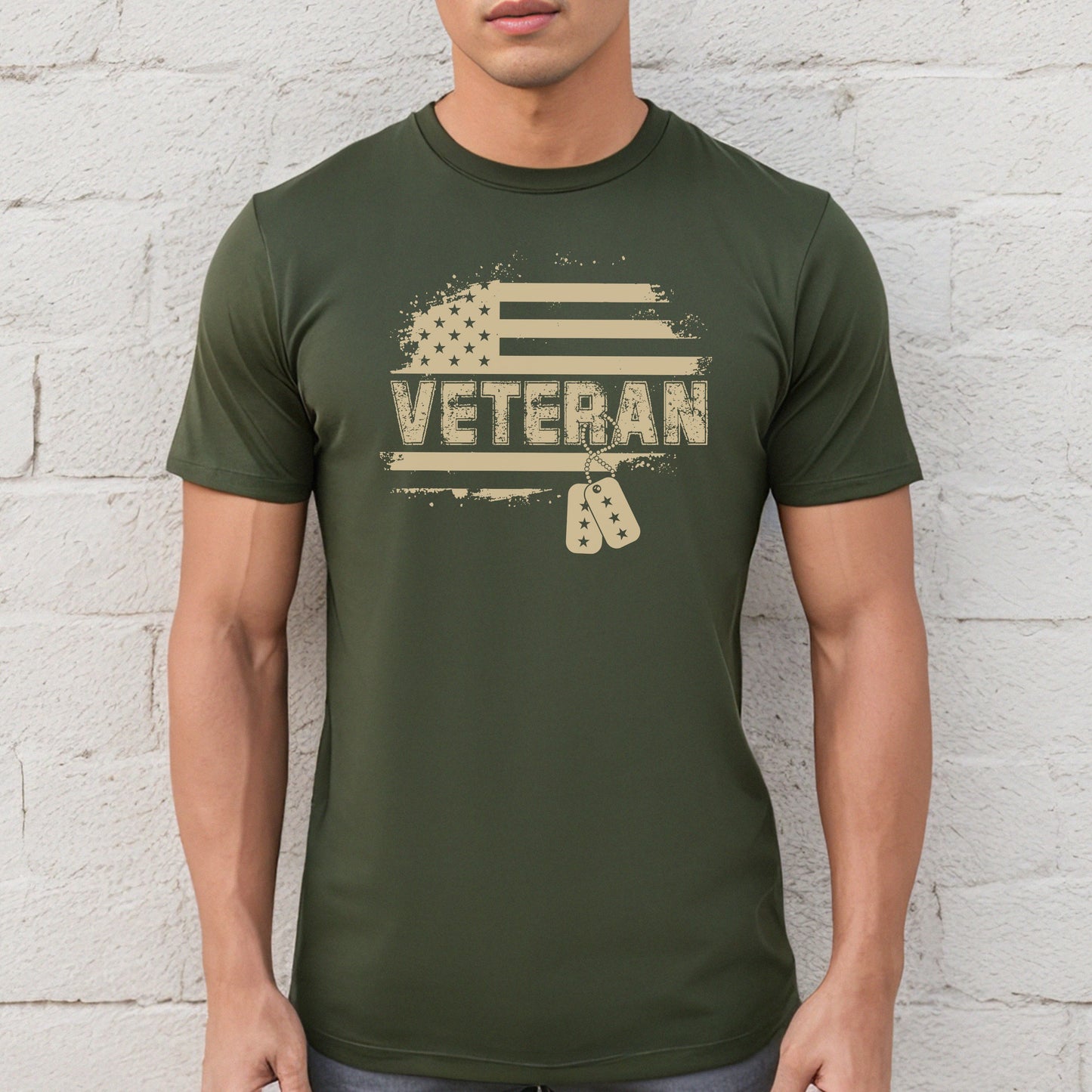 Flag and Veteran text with dog tags on military green performance t-shirt, modeled against white wall.